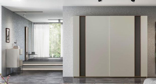 Armario de dormitorio con puertas correderas modelo MEDIUM de la empresa EMEDE en color blanco con detalles en verde oscuro y marrón